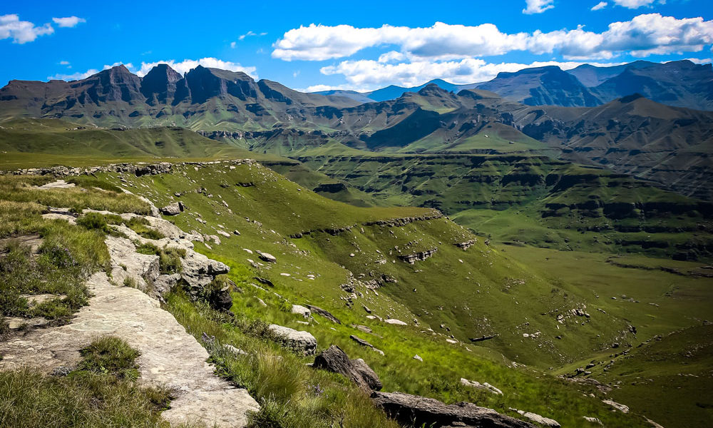 Hiker standing on a peak in the Drakensberg Mountains 