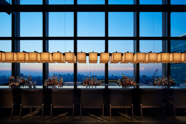 A luxurious suite at Aman Tokyo with panoramic city skyline views 