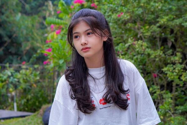 Young woman with long, wavy hair